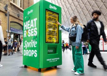 EDITORIAL USE ONLY 
Members of the public interact with prototype smart vending machine, as it is unveiled at London’s King’s Cross station by Sprite to bring to life their ‘Heat Happens’ campaign. Picture date: Wednesday July 12, 2023. PA Photo. The ‘smart vending machine’ uses live data to react to annoying moments of everyday commuter ‘heat’ - whether that’s ticket barrier bottlenecks, other people getting into your personal space or a train leaving 1 minute early - as the heat goes up, Sprite drops. Photo credit should read: David Parry/PA Wire
